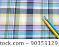 Blue / yellow check cloth and colored pencils 90359129