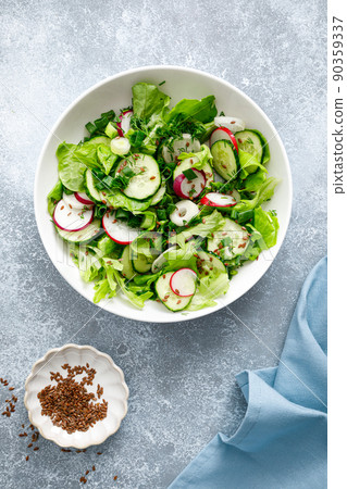 Salad with fresh green lettuce, radish and cucumber Salad with fresh green lettuce, radish and cucumber 90359337