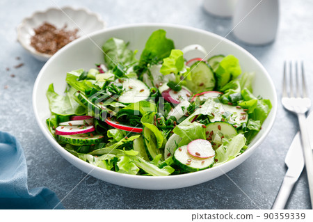 Salad with fresh green lettuce, radish and cucumber 90359339