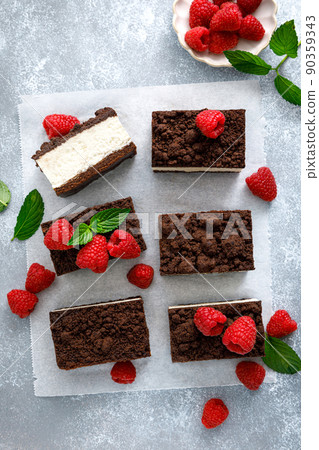 Chocolate cube cake, sliced brownie cheesecake with fresh raspberry Chocolate cube cake, sliced brownie cheesecake with fresh raspberry 90359343