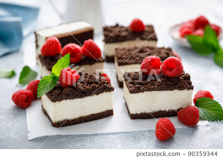 Chocolate cube cake, sliced brownie cheesecake with fresh raspberry Chocolate cube cake, sliced brownie cheesecake with fresh raspberry 90359344