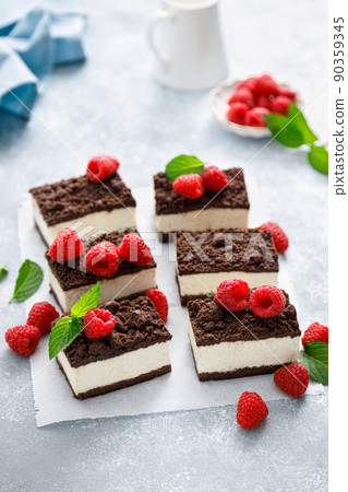Chocolate cube cake, sliced brownie cheesecake with fresh raspberry Chocolate cube cake, sliced brownie cheesecake with fresh raspberry 90359345