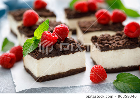Chocolate cube cake, sliced brownie cheesecake with fresh raspberry Chocolate cube cake, sliced brownie cheesecake with fresh raspberry 90359346