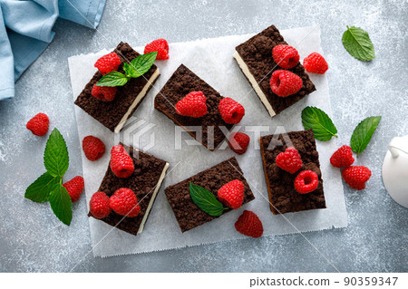 Chocolate cube cake, sliced brownie cheesecake with fresh raspberry 90359347