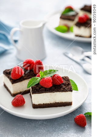 Chocolate cube cake, sliced brownie cheesecake with fresh raspberry Chocolate cube cake, sliced brownie cheesecake with fresh raspberry 90359349