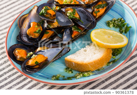 Mussels with herbs on plate Mussels with herbs on plate 90361378