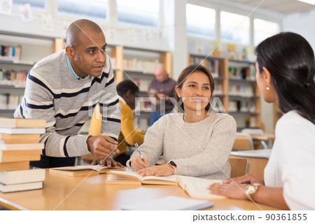 Adult people gaining skills at public library Adult people gaining skills at public library 90361855