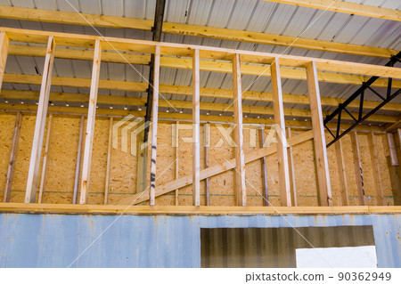 Building construction site with metal frames industrial building being built by office building 90362949