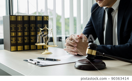 Professional man lawyers work at a law office There are scales, Scales of justice, judges gavel, and litigation documents. Concepts of law and justice Professional man lawyers work at a law office There are scales, Scales of justice, judges gavel, and litigation documents. Concepts of law and justice 90363414