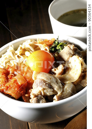 Bibimbap bowl and wakame soup with lots of ingredients such as bean sprout namul, kimchi, and pork Bibimbap bowl and wakame soup with lots of ingredients such as bean sprout namul, kimchi, and pork 90364334