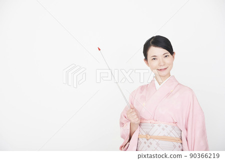 A woman in a kimono with a pointer 90366219