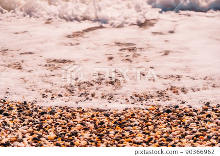 Abstract nature summer or spring ocean sea background. Small waves on golden warm water surface in motion blur with bokeh lights from sunset. Holiday, vacation and recreational background concept Abstract nature summer or spring ocean sea background. Small waves on golden warm water surface in motion blur with bokeh lights from sunset. Holiday, vacation and recreational background concept 90366962