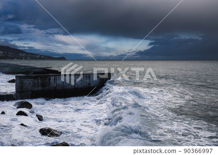Storm at sea with waves during rain and cloudy in Alupka. Crimea Storm at sea with waves during rain and cloudy in Alupka. Crimea 90366997