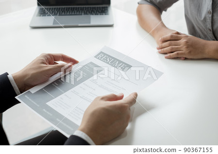 Business people hold a resume and talk to job applicants for job interviews about careers and Their personal history in the company. Recruitment concepts Business people hold a resume and talk to job applicants for job interviews about careers and Their personal history in the company. Recruitment concepts 90367155