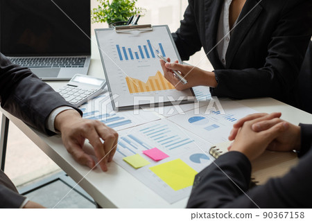 Business leaders talk about charts, financial graphs showing results are analyzing and calculating planning strategies, business success building processes Business leaders talk about charts, financial graphs showing results are analyzing and calculating planning strategies, business success building processes 90367158