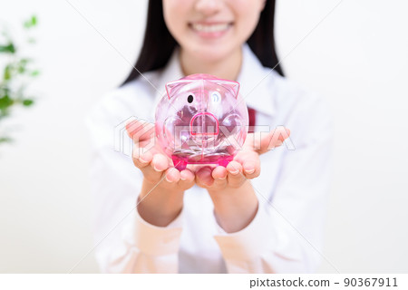 A high school girl holding a piggy bank with both hands happily without a face 90367911