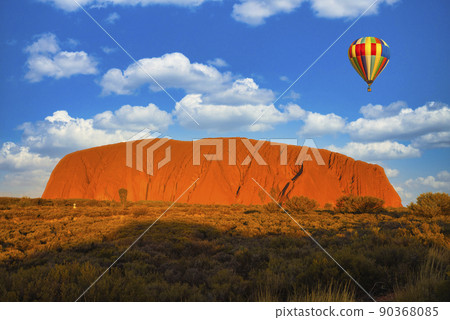 Balloon floating over Ayers Rock Balloon floating over Ayers Rock 90368085