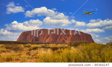Aircraft flying over Ayers Rock 90368247
