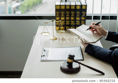 Professional man lawyers work at a law office There are scales, Scales of justice, judges gavel, and litigation documents. Concepts of law and justice Professional man lawyers work at a law office There are scales, Scales of justice, judges gavel, and litigation documents. Concepts of law and justice 90368258
