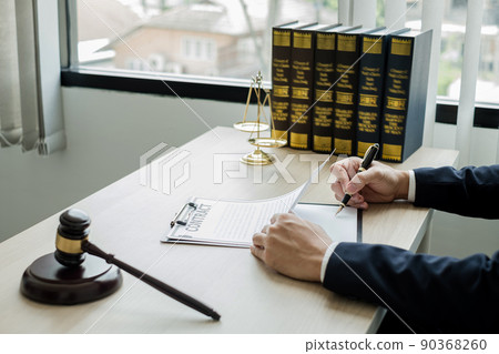 Professional man lawyers work at a law office There are scales, Scales of justice, judges gavel, and litigation documents. Concepts of law and justice Professional man lawyers work at a law office There are scales, Scales of justice, judges gavel, and litigation documents. Concepts of law and justice 90368260