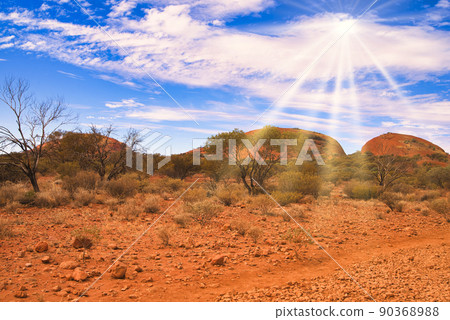 Sun rays shining into Mount Olga Sun rays shining into Mount Olga 90368988