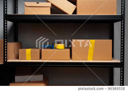 Rack shelves with paper boxes in warehouse. Rack shelves with paper boxes in warehouse. 90369338