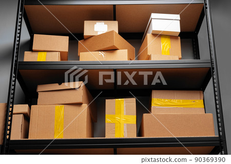 Rows of shelves with cardboard boxes in modern warehouse Rows of shelves with cardboard boxes in modern warehouse 90369390