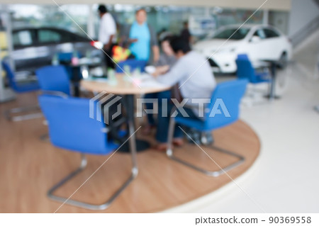blur photo of car showroom with salesman and customers blur photo of car showroom with salesman and customers 90369558