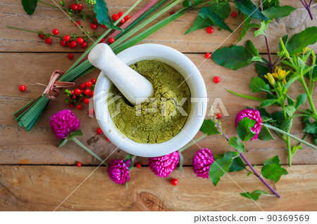 Fresh herbs powder in the mortar, alternative medicine 90369569
