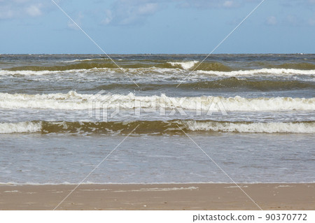 View on beach and sea waves. Stormy and windy day at sea. Travel View on beach and sea waves. Stormy and windy day at sea. Travel 90370772