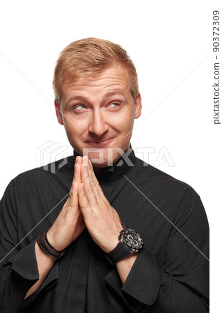 Smiling young man keeping hands together. Cunning handsome guy planning. Isolated front view on white background. Smiling young man keeping hands together. Cunning handsome guy planning. Isolated front view on white background. 90372309