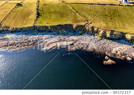 Aerial view of the amazing rocky coast at Ballyederland by St Johns Point in County Donegal - Ireland. Aerial view of the amazing rocky coast at Ballyederland by St Johns Point in County Donegal - Ireland. 90372357