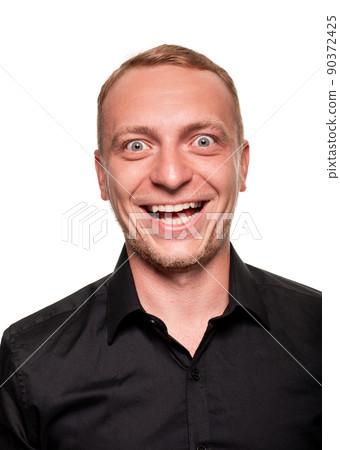 Handsome young blond man in a black shirt, isolated on a white background 90372425