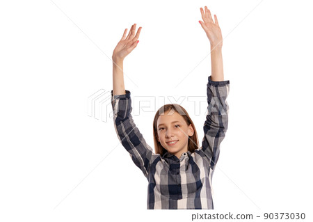 Beautiful teenage girl in a casual checkered shirt is posing isolated on white studio background. 90373030