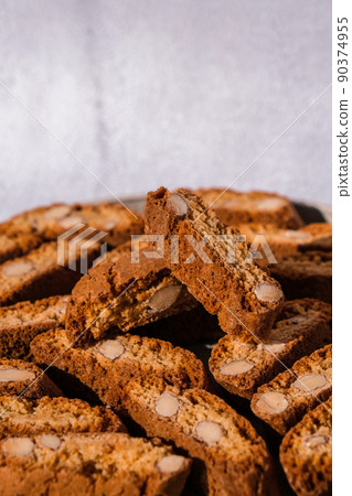 Biscotti Cantuccini Cookie Biscuits with Almonds Shortbread. Healthy eating food. Homemade fresh Italian cookies cantuccini stacks and organic almond seeds. Vegan dieting vegetarian 90374955