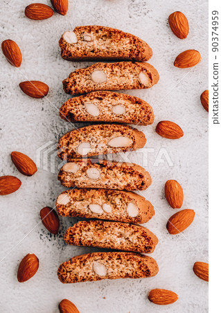 Biscotti Cantuccini Cookie Biscuits with Almonds Shortbread. Healthy eating food. Homemade fresh Italian cookies cantuccini stacks and organic almond seeds. Vegan dieting vegetarian Biscotti Cantuccini Cookie Biscuits with Almonds Shortbread. Healthy eating food. Homemade fresh Italian cookies cantuccini stacks and organic almond seeds. Vegan dieting vegetarian 90374959
