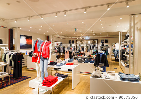Luxury shopping mall department, clothing store interior. Panorama, Vilnius, Lithuania 10 April 2022 90375356