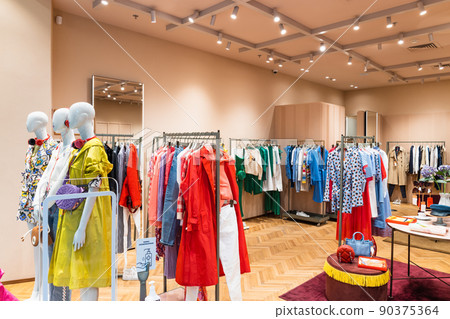 Interior of a brand new fashion clothing store. Panorama, Vilnius, Lithuania 10 April 2022 90375364