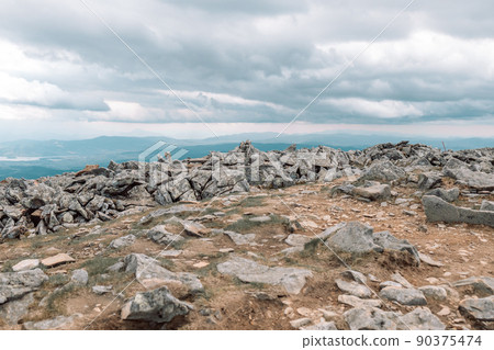 Babia Gora National Park (Babiogorski Park Narodowy) in Poland. Mountain landscape of Babia Gora massif nature with sharp stones and green grass 90375474