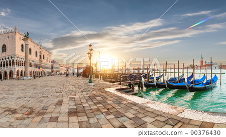 Doge's Palace and gondolas pier near San Marco Square at sunrise, Venice, Italy 90376430