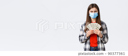Money transfer, investment, covid-19 pandemic and working from home concept. Serious-looking frustrated woman in medical mask found boyfriend cash, squinting camera with disbelief Money transfer, investment, covid-19 pandemic and working from home concept. Serious-looking frustrated woman in medical mask found boyfriend cash, squinting camera with disbelief 90377361