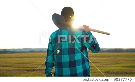 agriculture. farmer with a shovel walk in the field. agriculture business harvesting portrait of a farmer man with shovel sunset a walk to work in the field. business natural products harvesting 90377770