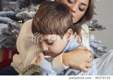 Little preschool boy helping mother to decorate Christmas tree at home, Little preschool boy helping mother to decorate Christmas tree at home, 90378720