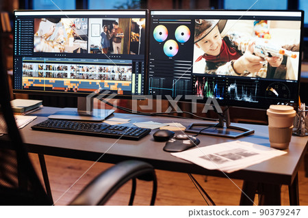 Image of table with computer with software for editing photos on monitor at office 90379247