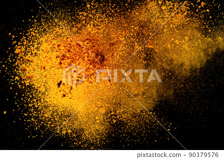 Explosion, Splashes of turmeric on a black background. India Seasoning. The orange powder of the turmeric root. Explosion, Splashes of turmeric on a black background. India Seasoning. The orange powder of the turmeric root. 90379576