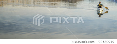 senior male is paddling expedition canoe 90380949