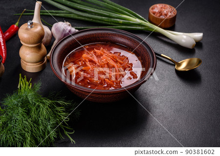 Traditional Ukrainian borscht with beets, tomatoes, garlic, spices and herbs. Ukrainian dish, traditional food Traditional Ukrainian borscht with beets, tomatoes, garlic, spices and herbs. Ukrainian dish, traditional food 90381602