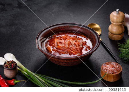 Traditional Ukrainian borscht with beets, tomatoes, garlic, spices and herbs. Ukrainian dish, traditional food Traditional Ukrainian borscht with beets, tomatoes, garlic, spices and herbs. Ukrainian dish, traditional food 90381613