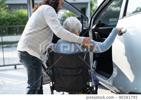 Asian senior or elderly old lady woman patient sitting on wheelchair prepare get to her car, healthy strong medical concept. Asian senior or elderly old lady woman patient sitting on wheelchair prepare get to her car, healthy strong medical concept. 90381795