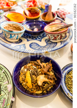 Various spices in colorful small bowls Preparing Moroccan dishes 90382162